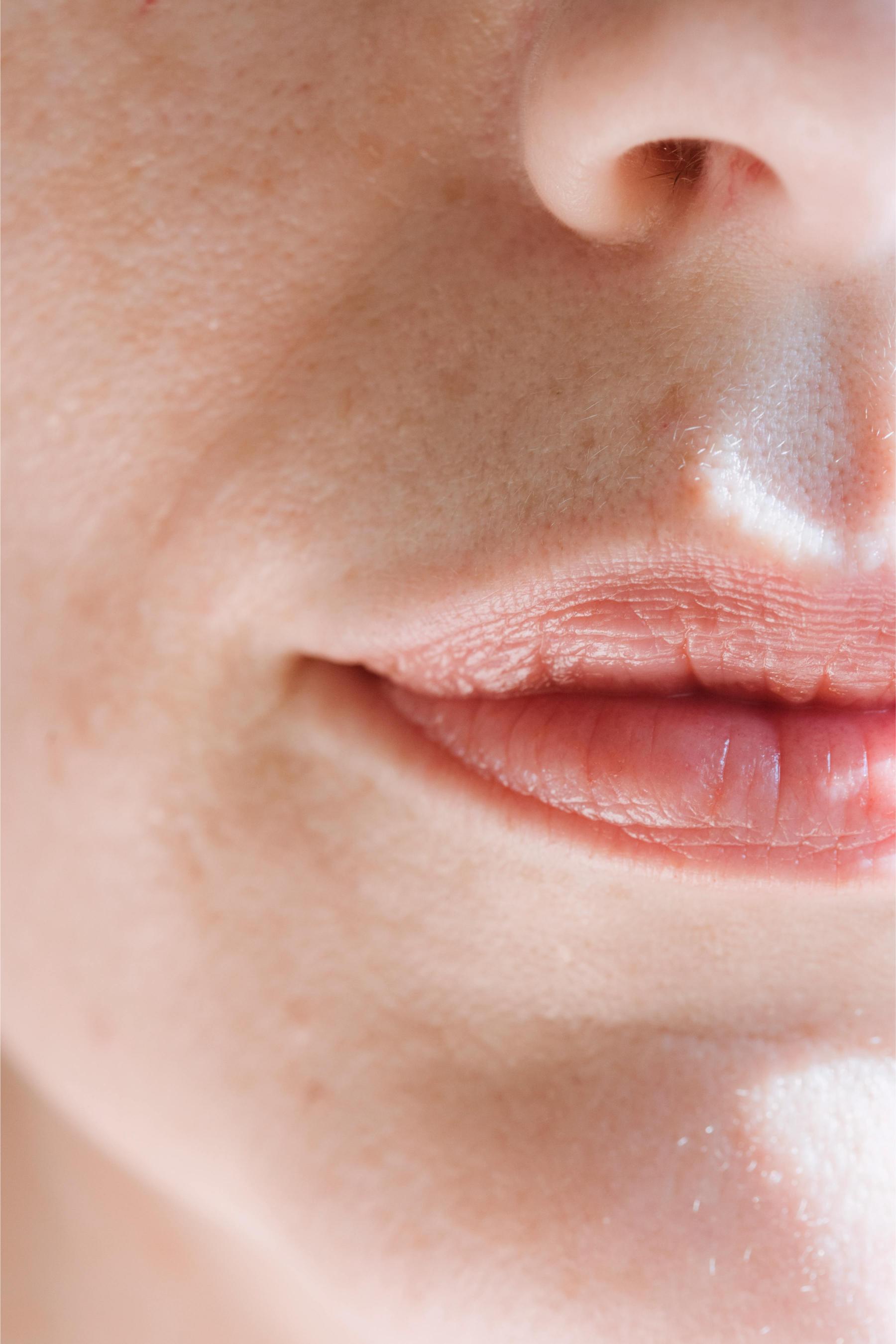Close up of woman's face focusing on her nose and lips